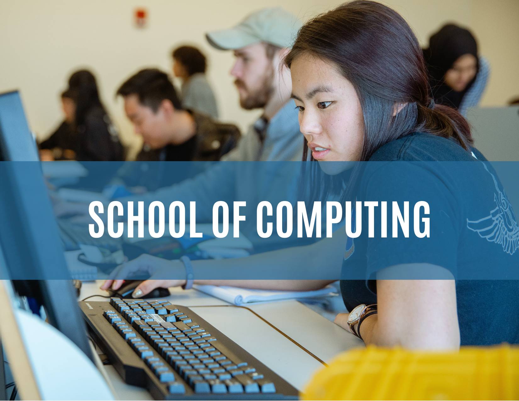 Link to Program plans for School of Computing - Computing student reviewing code